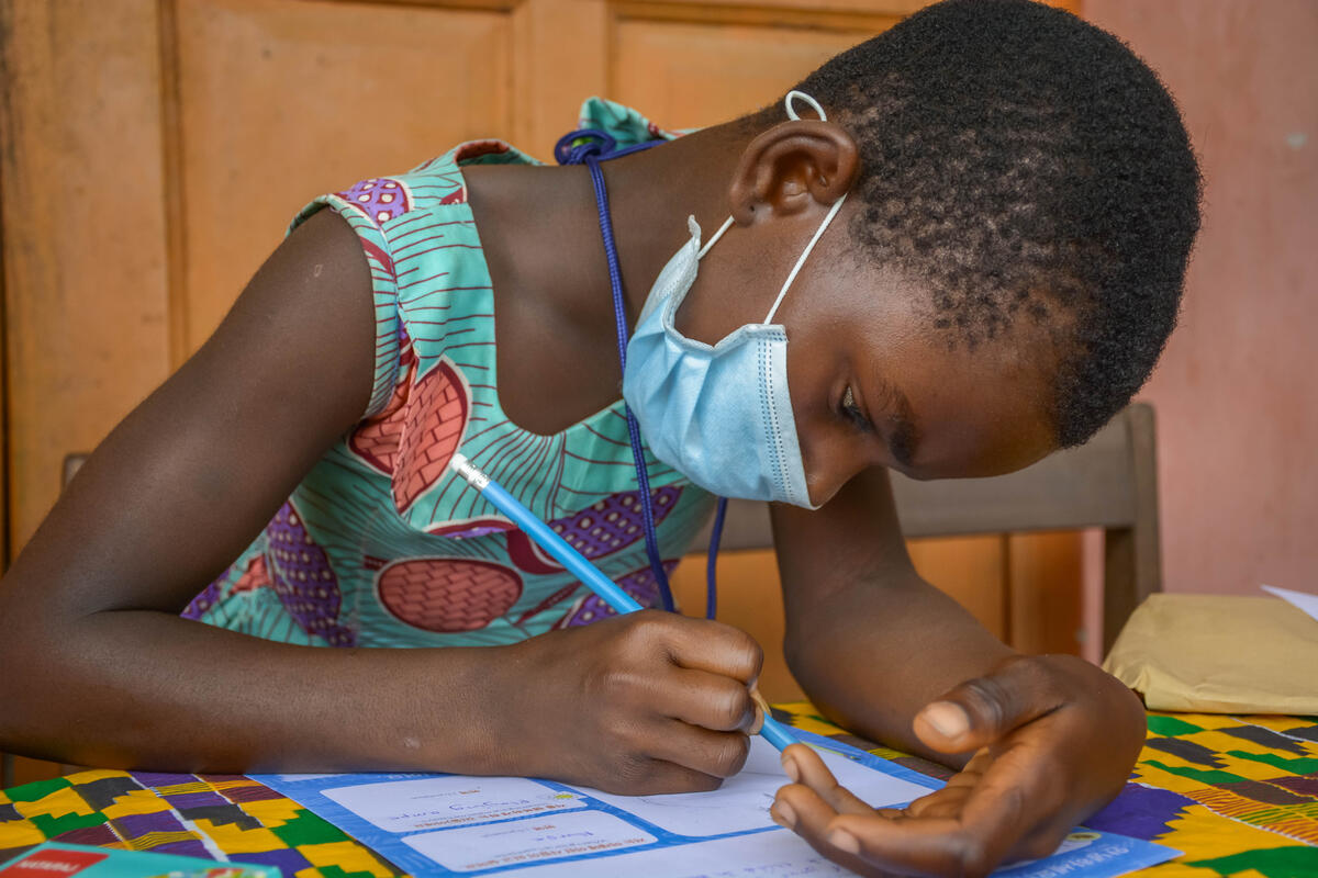 A pictures of a child in Ghana involved in various fun activities during Chosen party