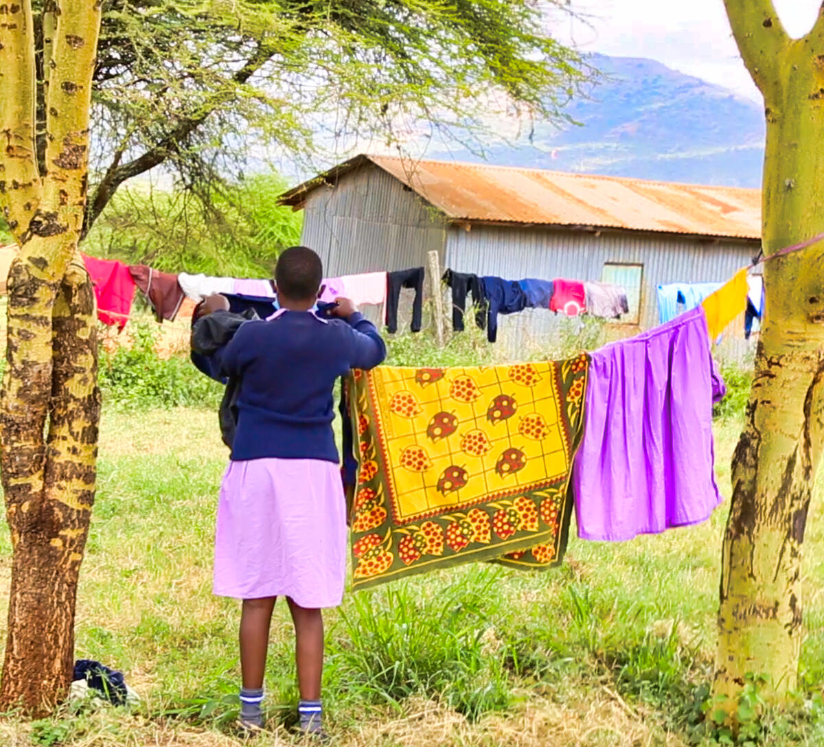 Esther from Kenya doing her routine cleaning at the dormitories