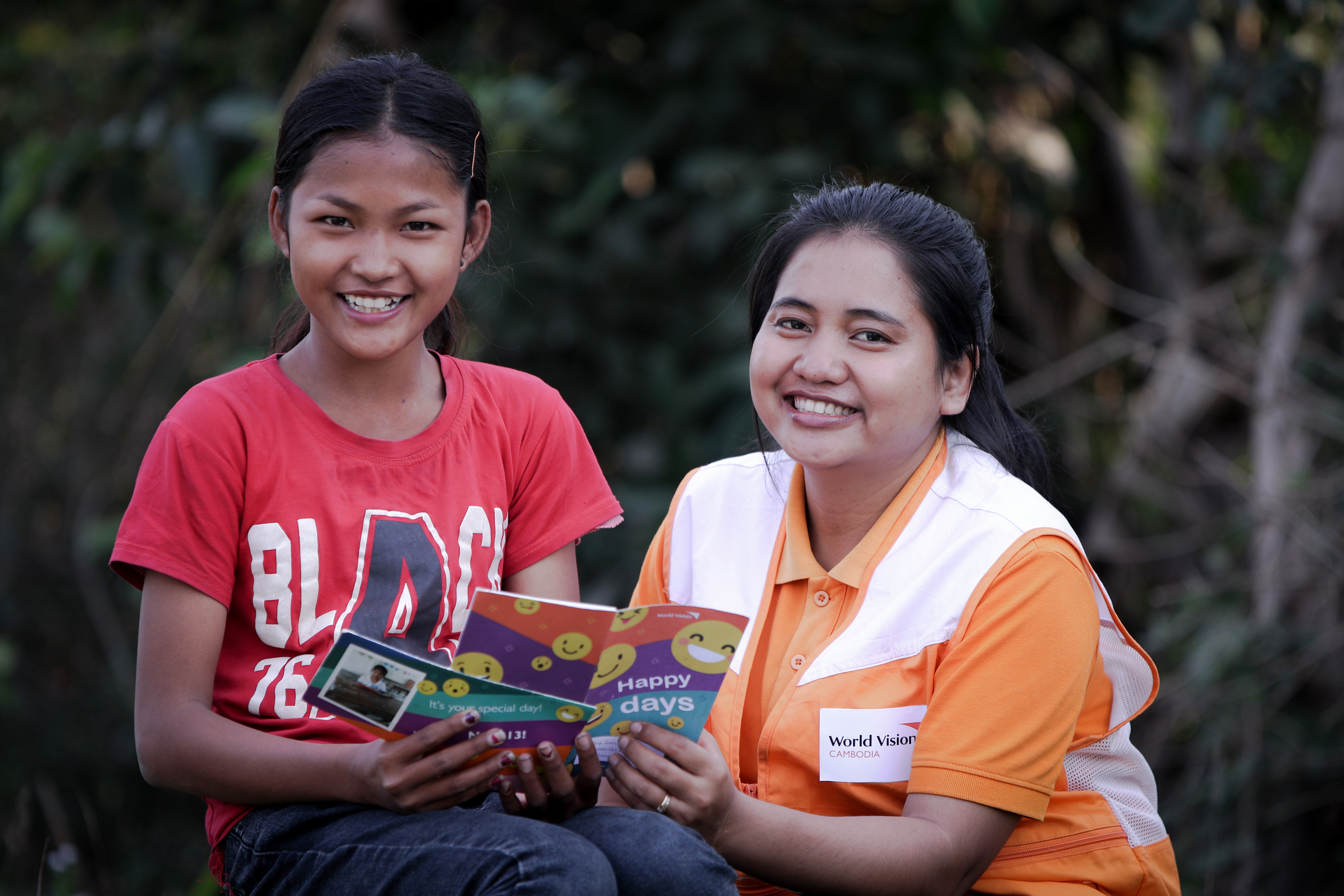 World Vision staff and sponsored child Ny from Cambodia