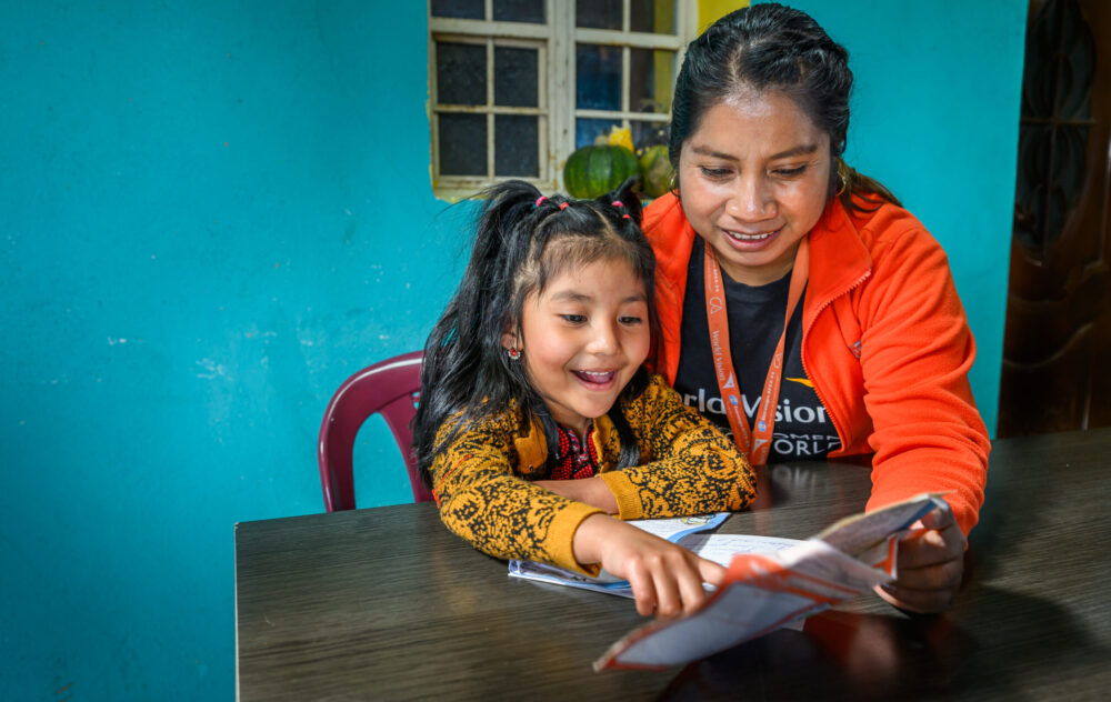 Ileana Gomez, World Vision Guatemala staff member, helps sponsored girl Hanny, 5, read letters from her sponsor. Hanny's mother, Maria, keeps these cherished letters on the door of their fridge -- a wonderful counterpart to the way many sponsors keep a photo of their sponsored child on their home fridge.
Summary: In 2023, 24 chickens arrived at Maria's house—purchased through World Vision’s Gift Catalog. “When the Gift Catalog chickens came it was a great moment,” says Maria. “It helped us in the right moment to move forward.” With the gift, came invaluable training from World Vision staff.
“I had chickens before, but I was doing it, as we say, blindly,” says Maria. “I didn’t know how to breed them. When the Gift Catalog project came, they taught us how to take care of our chickens—the medicine we should give them.”
Now they had protein daily. “We ate eggs breakfast, lunch, and dinner,” says Beverlyn, Maria's daughter. “Then we had a surplus. People were able to buy eggs from us. My mom sold them to stores.”
In 2024, Maria and the family had grown the flock to 200, so many that they moved the chickens into the old grocery store and built a new grocery store next door. With the money she made from selling chickens and eggs, Maria bought pigs. And she didn’t stop there. Next to the grocery store, she started a hair salon for Beverlyn to run.
San Bartolo Aguas Caliente area program, Guatemala.
Refer to story, 'The good mother'